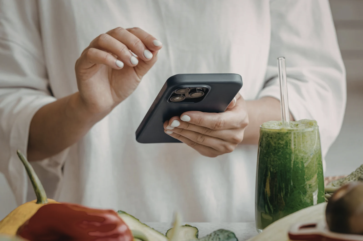 Woman logging meal on her smartphone