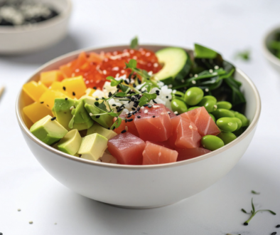 Bowl containing ahi tuna, avocado, quinoa, vegetables
