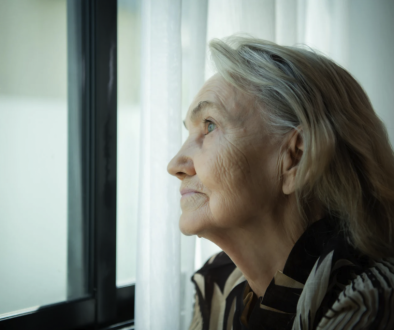 Lonely woman staring out a window