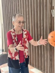 Joyce Fujimoto catching a ball