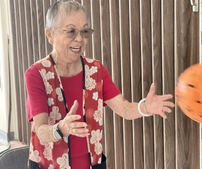 Joyce Fujimoto catching a ball