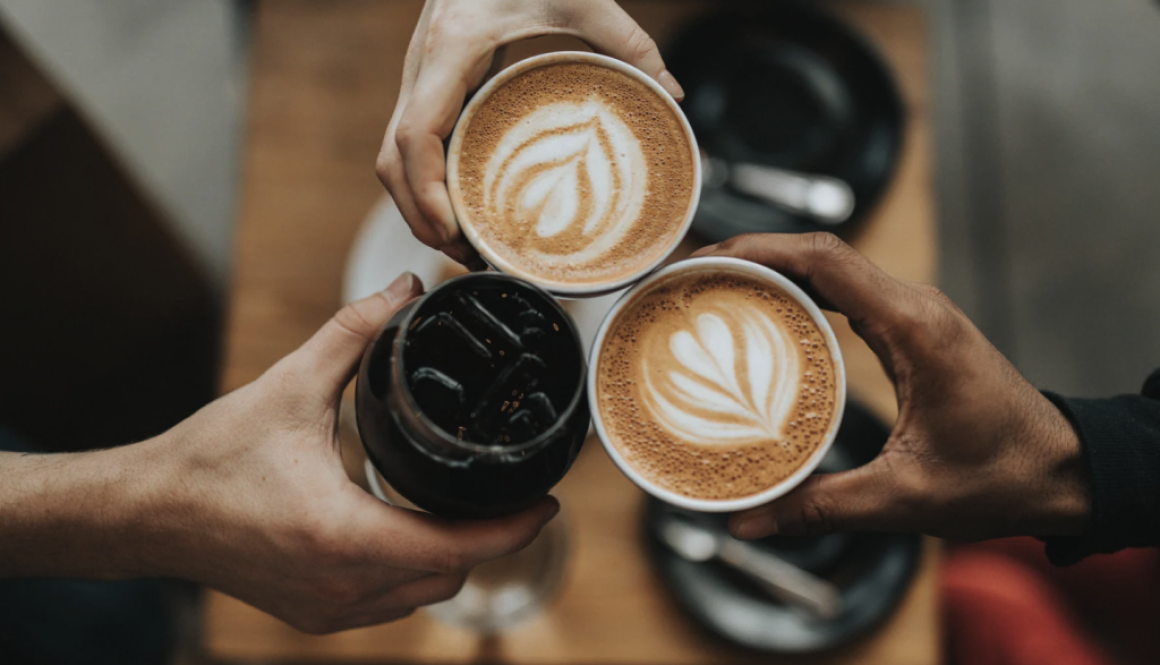 People holding two cups of espresso and one iced coffee