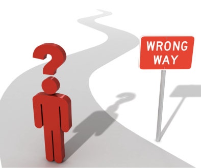 image of a stick figure man with a question mark above his head on a road marked with a 'wrong way' sign